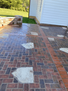 Completed tuckpointing restoration of a St. Louis patio, improving brickwork durability.